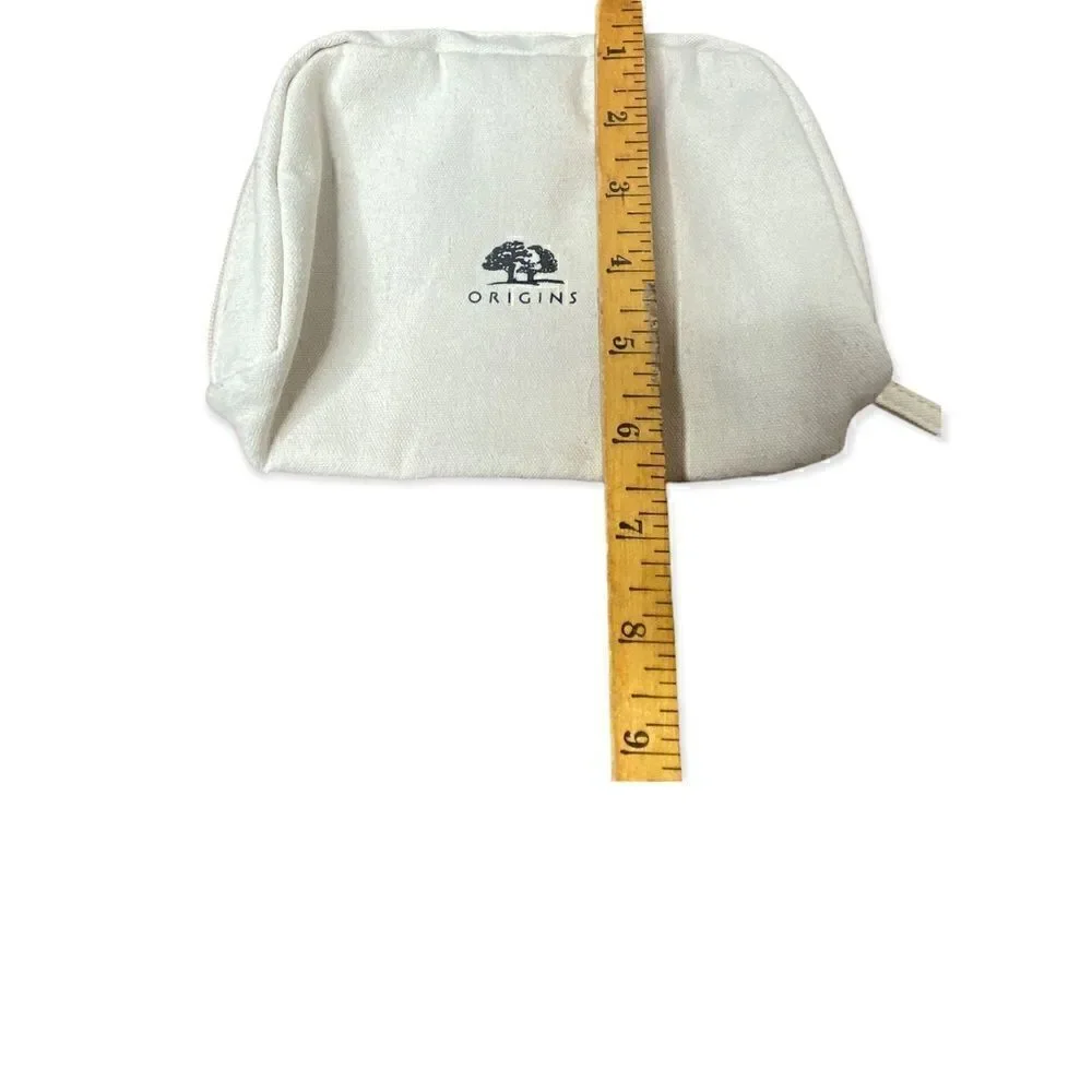 Origins cream canvas make up bag with zip closure small marks inside